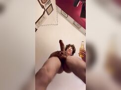 cute nerdy compare his cock with a bottle of beer