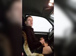 Ginger boy with toy in car