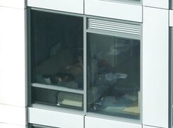 Neighbour has no curtains