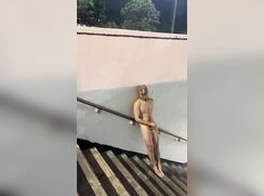 Naked and jerking outside on the stairway
