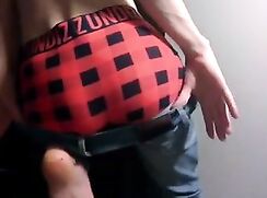 Twink porn busts a nut wearing his jeans