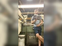 Exhibitionist boy jerking in factory