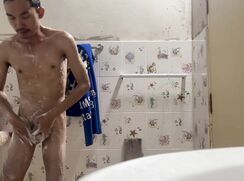 Skinny twink taking his morning shower