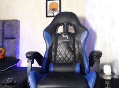 Lean, inked Latino stroking his big shaved dick in a gaming chair