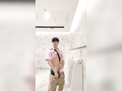 Asian twink waves his willy in the public toilet