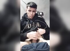 Horny Latino in a hoodie beats off