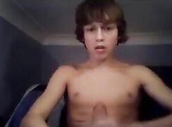Extremely cute 18 year old blond boy with large penis jacks off and cums on cam.