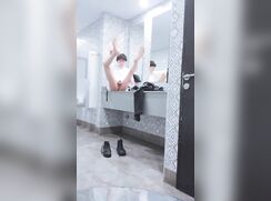 Twink naked in restroom fingers and walks out