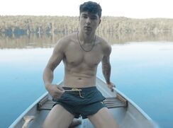 Young fit jock jerking his cock on the lake and cumming