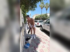 cute blonde risky striping in the street