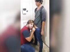 Cute boy gets blowjob in restroom