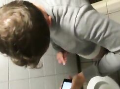 cute twink bates while texting in public stall