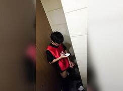 Asian twink caught while he jerks one out in the public toilet.