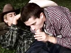 Blond and brunette cowboys fuck outdoor at night