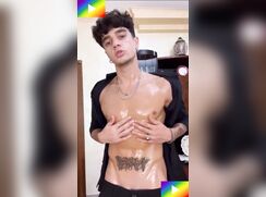# HTW - Oil on his big cock, cumming on his black shirt.