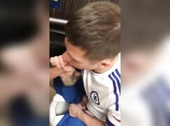 tat dude sucks cock and drinks cum in public stall