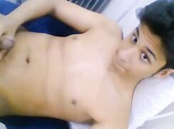 Latino twink jerks off and cums on his chest