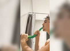 German faggot in the bathtub sucking a dildo