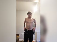 Showing his nude body