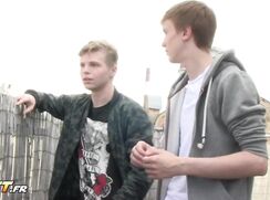 Two boys compare their cocks