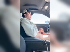 Jerking his hung cock in a car